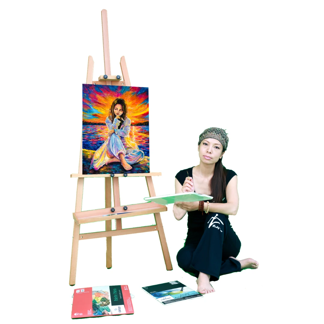 XinYi painting beside an easel