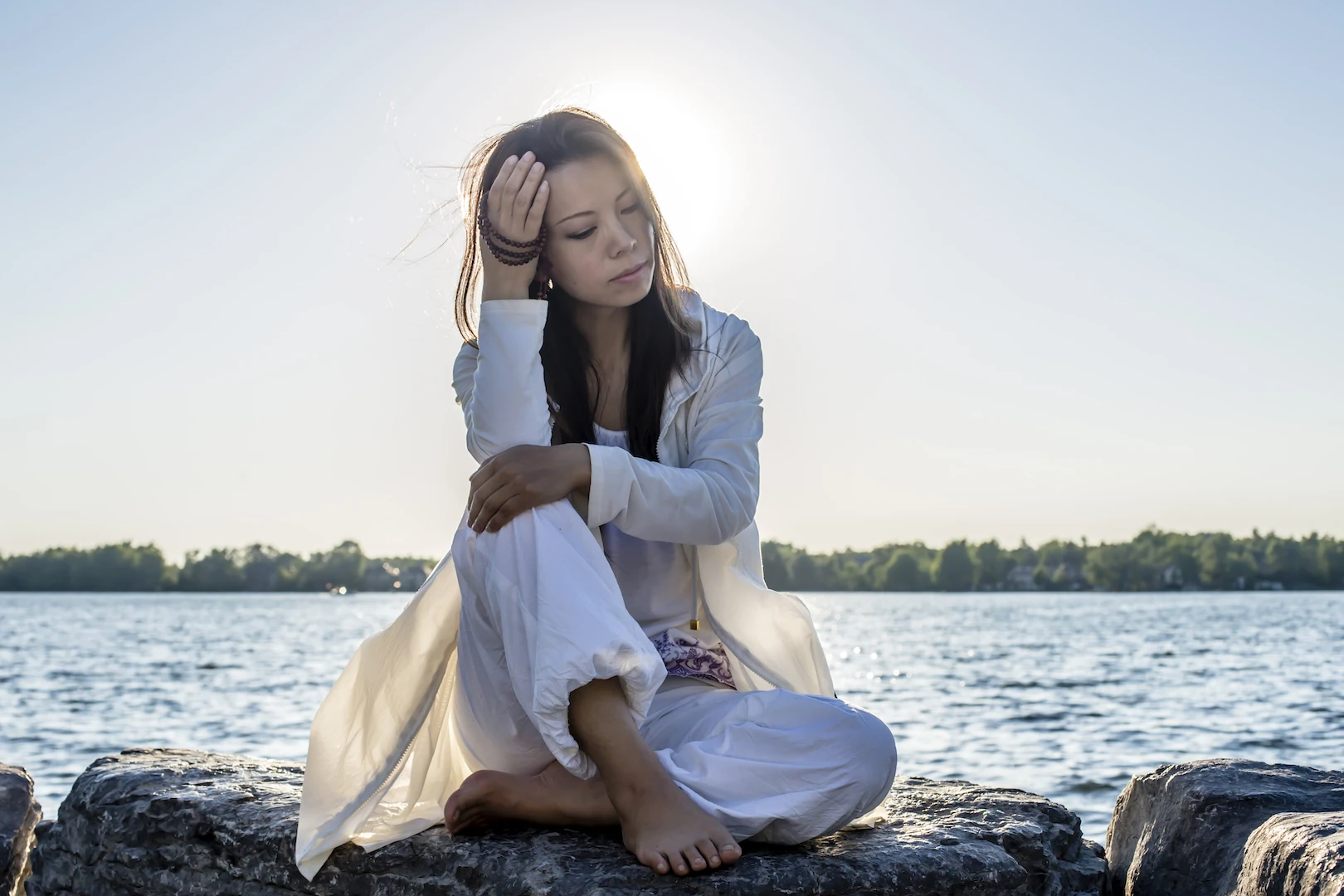 XinYi meditating by the water